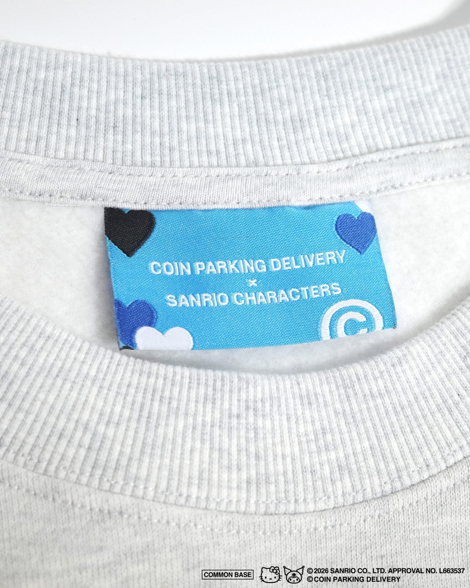 COIN PARKING DELIVERY × SANRIO CHARACTERS PACTHWORK SWEATSHIRT